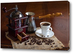  Black coffee foil packaging bag on wooden table top view. Spilled beans flat lay concept. Room for text.