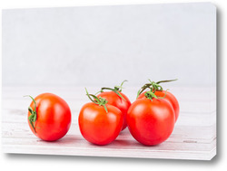    Fresh tomatoes on the old wooden table